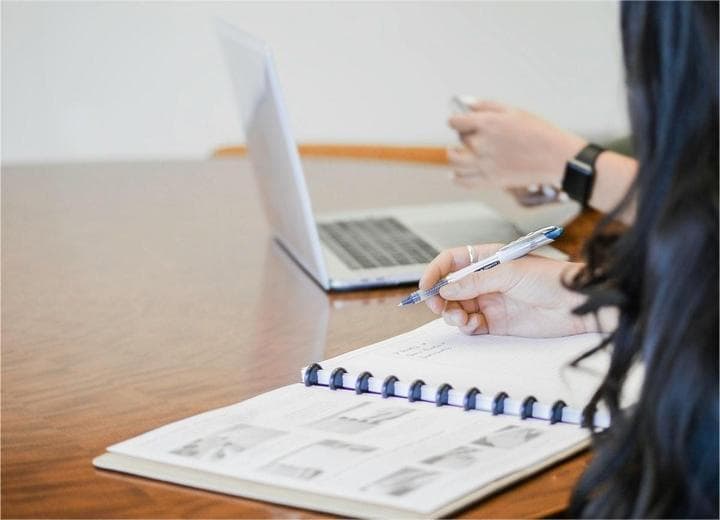 Business meeting with notes and laptop