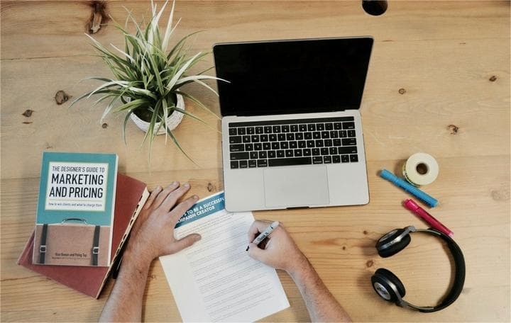 A desk and notebooks for digital marketing