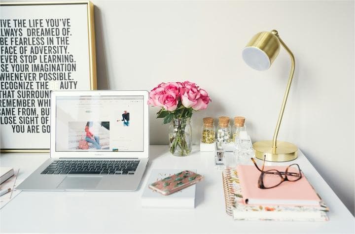 Laptop with other device showing information about executive assistant