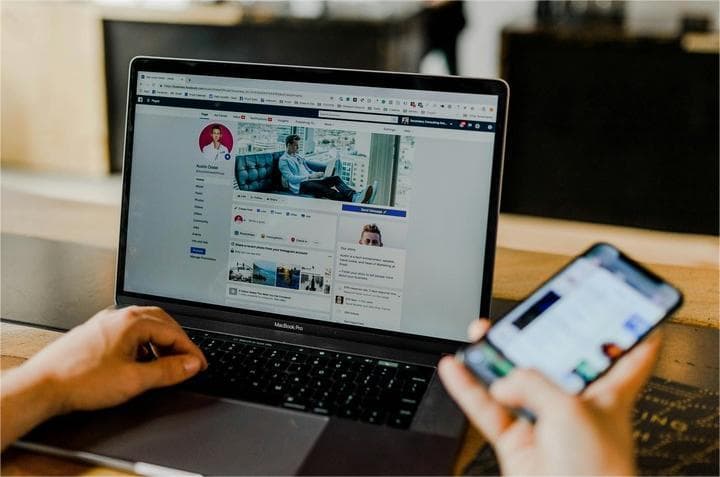 A laptop and a phone showing information about social media marketing